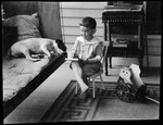 Tots- Don F. Writes On Don Nevins Piazza. He Sits With Dog On Bed by George French