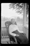 Portrait- Mrs. I Pocumton Sits On Porch In Wicker Rocker- Granma Sears by George French