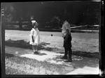 Tots- Barbara And Don Bounces Ball On Sidewalk by George French