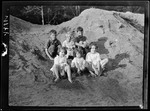 Tots- Group Of 6 Tots Sit In Sawdust by George French