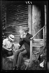 Gransir Sit's On Steps, Smoke's Pipe by George French