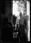 George French Carryingn A Pail Of Water By Back Door. by George French