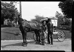 Couple Standing Beside A Horse Drawn Wagon With "Parsem 1885" On Side #2 by George French