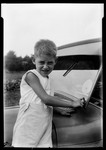 Boy Pointing To A Reflection Of An Eclipse In An Auto Windshield by George French