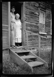 Don French And His Grandmother Standing In Doorway Of Homestead by George French