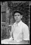Donald French Holding First Place Trophy For 1930 Horsehoe Pitching Championship by George French