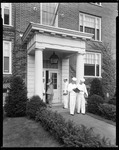 Students (Navy Prep) Leave Building, Close Up Of Door Area At Bates College by George French