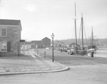 Reproduction Of Old Seaport At Mystic, Conn, Shows Cobblestone Road And Stone Building by George French