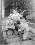 Three Children Playing Instruments On Steps Of House, Acting Up--French Children Don, Barbie And Boyd In New Jersey by George French