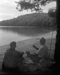 Jack Tells A Yarn At Long Pond, They Sit On Shore, Water And Mountain Behind In Parsonsfield by George French