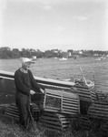 A Codger Works On His Lobster Traps, Boat, Water Behind At Bailey Island by George French