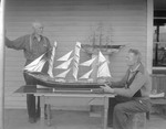 Mr Johansen Sits Looking Over A Model Boat That He Built, Others Nearby In Porter by George French