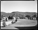 Howard's Cabins, Five Set In A Row, Mountains Behind In Woodstock, New Hampshire by George French