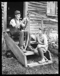 Old Timer Stringing A Bow For A Young Boy by George French