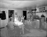 Family Reading And Relaxing Around The Kitchen Stove At The French Homestead by George French