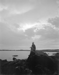 Man Sitting On Rock, Backlit, At Kennebunk Beach by George French