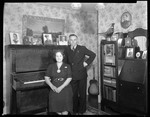 Clayton And Wife (Stacy) In Their Living Room, Bookcase/desk, Piano And Many Photos In View by George French