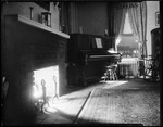 View Of A Room With Fireplace And Piano, Fireplace Is Lit And Stockings Hung, Music On Piano Closed by George French