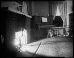 View Of A Room With Fireplace And Piano, Fireplace Lit And Stockings Hung From Mantle, Music On Piano Open by George French