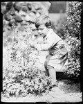 Boy In A Flower Garden Admiring A Columbine ( George Phillips) by George French