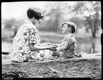 Boy ( George Phillips ) And Dot Holding Hands, Sitting On Ground by George French