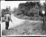 Man, Will, Looking At A Signpost At An Intersection Of Two Country Roads In Kezar Falls by George French