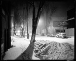 Town Street At Night, Cars Parked On Side Of Street, Lots Of Snow by George French