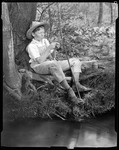 Young Boy With Straw Hat And Sapling Fish Pole, Can Of Worms, By Stream, Boy Has Hole In Pants ( Huck Finn) by George French