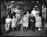Group Shot Of A Family Sitting Outside, " Sweet, Doe, Graland Group" by George French