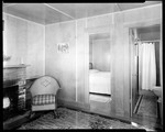 Interior Shot At Goodwin's Cabins, Living Room With Fireplace, Door To Bedroom And Bathroom by George French