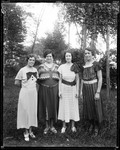 Outdoor Shot Of Four Ladies Facing Camera, Full View by George French