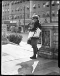 Newsboy Counts His Money On Street Corner (Donald) by George French