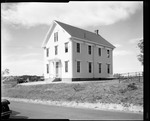 Two Story Building, Grange Hall Or Similar Type Of Building, Cars Parked Out Front. by George French