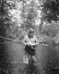Man Holding Fish He Caught Fly-Fishing by French George