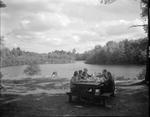Family Picnicking By Lakeside In Porter by French George