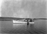 Lobsterman Hauling Traps From A Boat With A Spray Hood by French George