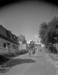 Neighborhood Scene With Children Playing Beside Road In Stonington by French George