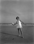 Girl On The Beach Playing Ball by French George