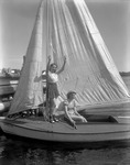 Two Teenage Girls On A Sailboat In Canton At Pinewood Camps by French George