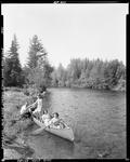 A Family Getting Out Of A Canoe At Cross Lake by French George