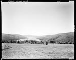 Distant View Of Wyman Lake And Surrounding Hills by French George