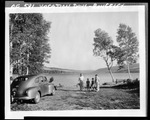 Family Picnicking By Lake In Rangeley by French George