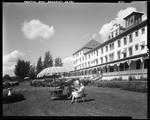 People Relaxing In Front Garden Of Large Hotel In Rangeley by French George