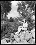 Young Girl Sitting On Rocks Picking Raspberries--Parsonsfield by French George
