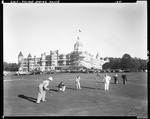 Group Of People Playing Golf, Poland Spring House In Background by French George