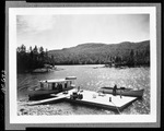 Motorboats Tied In At A Float On South Arm Pond by French George
