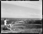 Couple Eating A Picnic Lunch On A Hill Overlooking Town Of Jefferson And Damariscotta Lake by French George