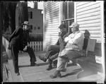 Two Men Sitting On A Bench Outside Of A Store In Farmington Falls, Another Standing Beside Them by French George