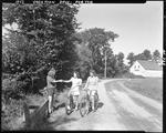 Three Girls Bicycling In Porter by French George