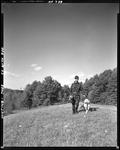 Partridge Hunter Walking Out Of The Woods With Dog--Hiram by French George